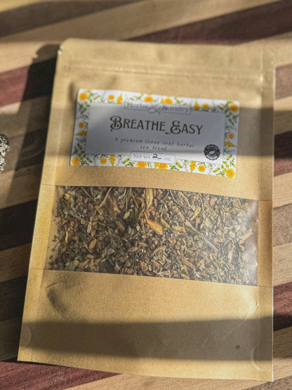 Close view of the Breathe Easy kraft pouch and its label on a striped wooden board