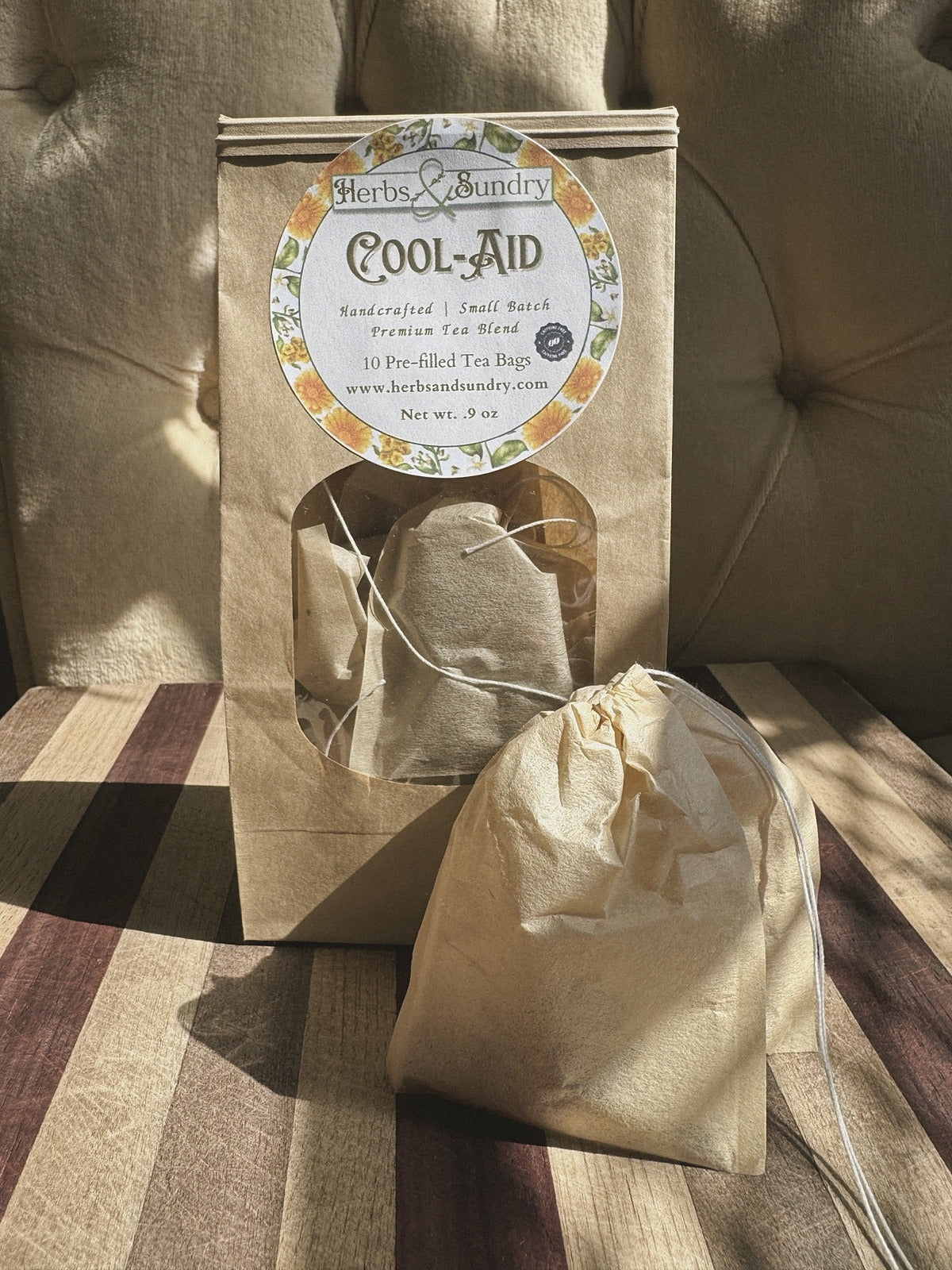 Kraft Cool-Aid pouch of ten pre-filled tea bags, with one unbleached drawstring tea bag set in front