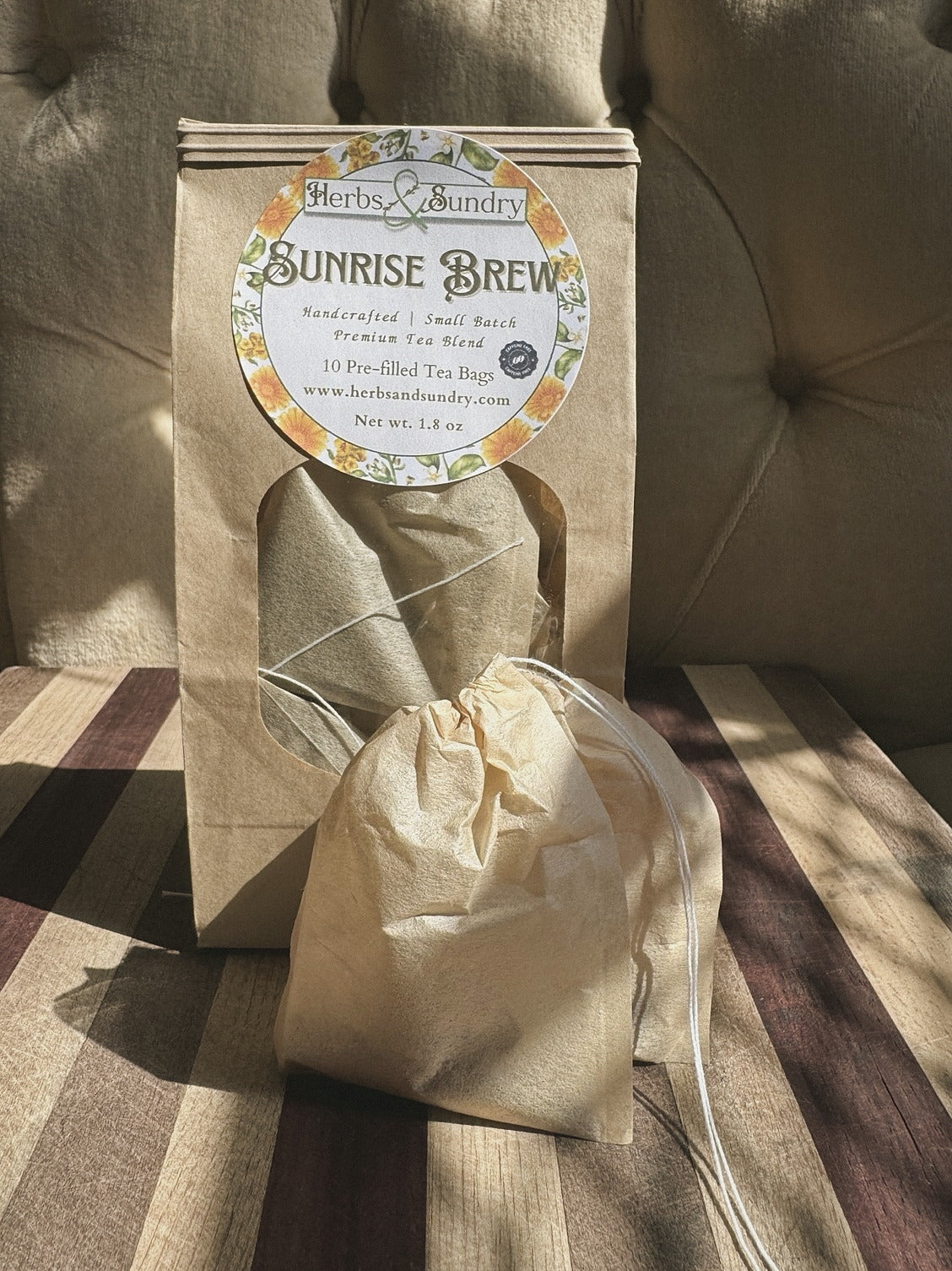 Kraft Sunrise Brew pouch of ten pre-filled tea bags, with one unbleached drawstring tea bag set in front
