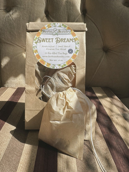 Kraft Sweet Dreams pouch of ten pre-filled tea bags, with one unbleached drawstring tea bag set in front